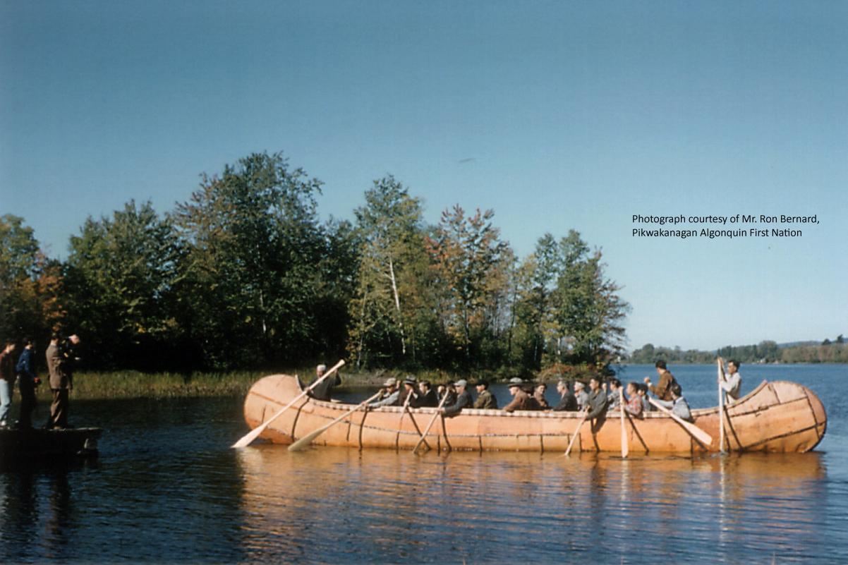 Photograph of thirty-six foot long Birch Bark Canoe built by the Algonquin Nation at Pikwanagan, Ontario, Canada